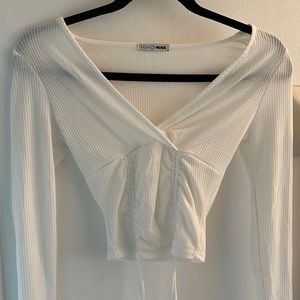 White deep V-neck top